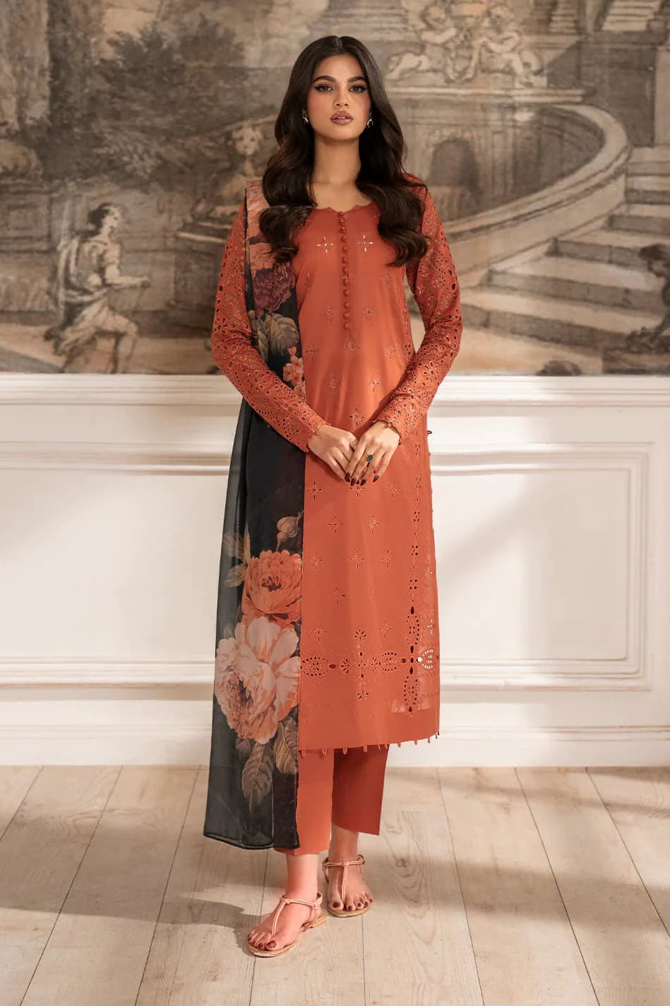 Rust orange chikankari unstitched 3 piece lawn suit with tonal cutwork embroidery and a dark floral printed contrast dupatta